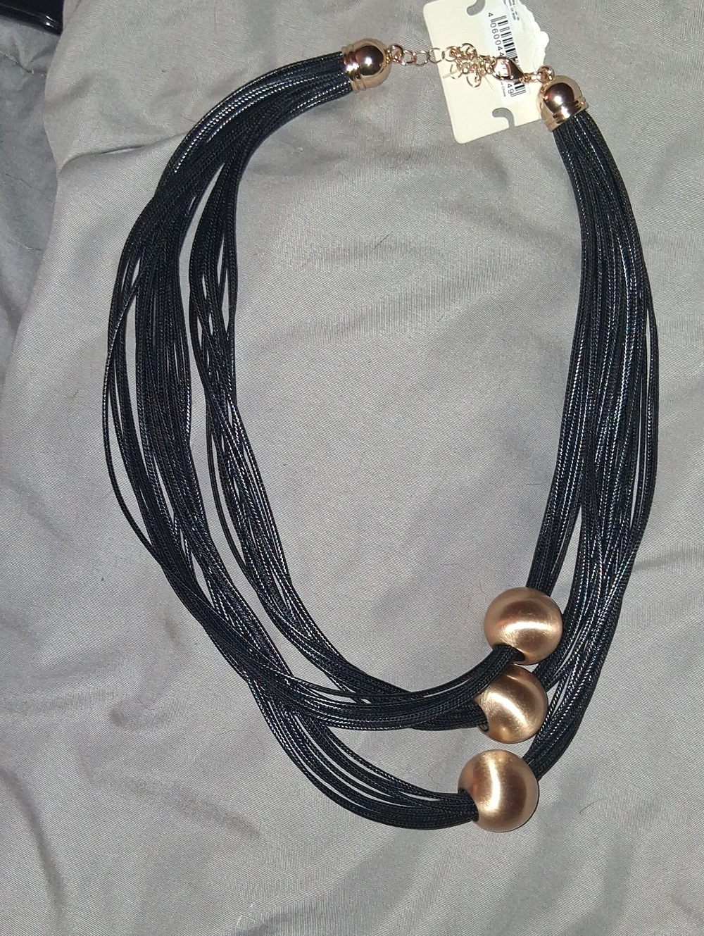Multi-Strand Black Necklace with Gold Accent Beads